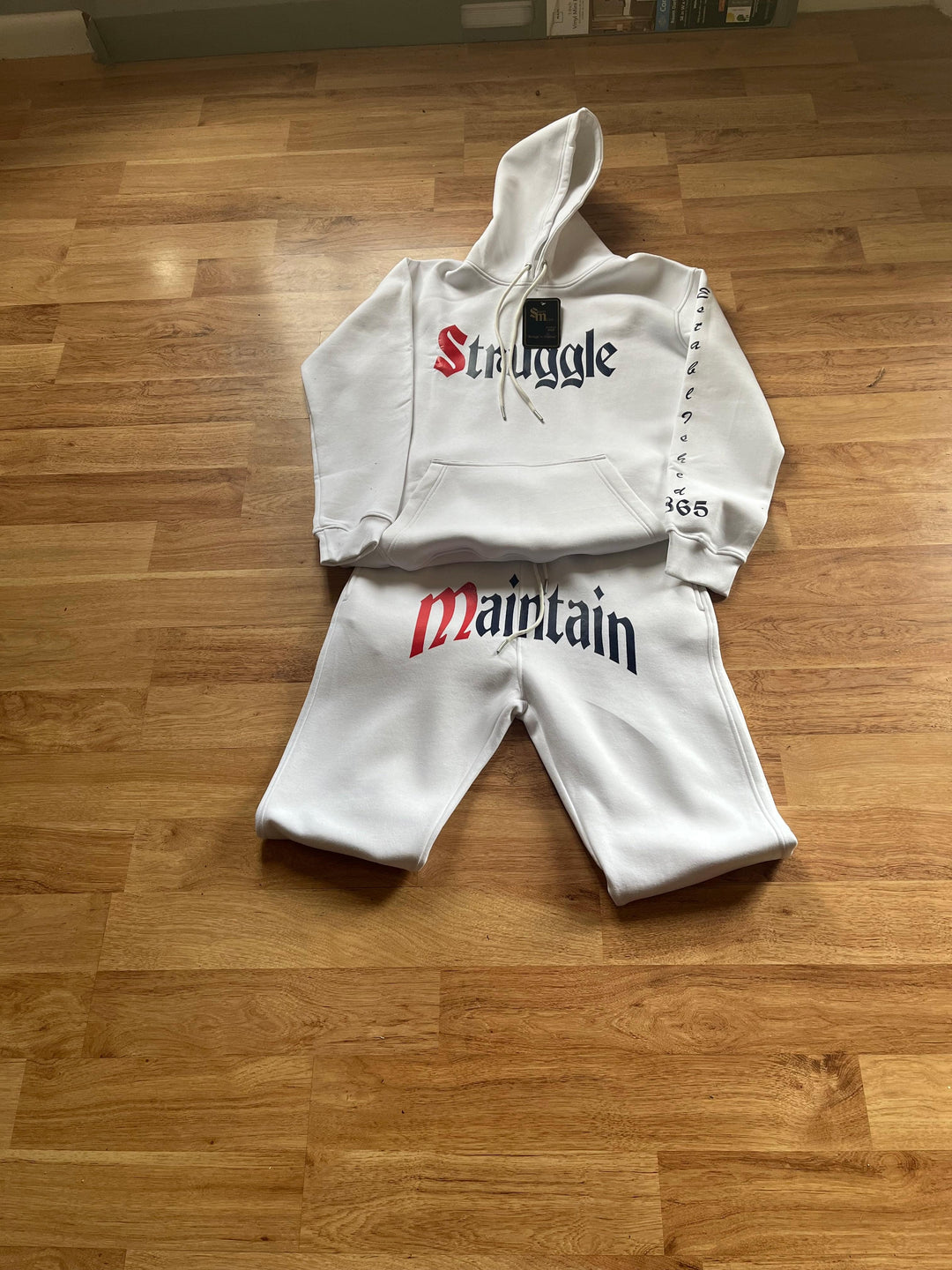 Street M.O.D.E 22 Jogger in White with Red and Blue Struggle to Maintain Logo